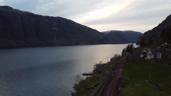 Late evening aerial Sorfjorden Vestland - Showing railway Bergensbanen and future rock dumping spot