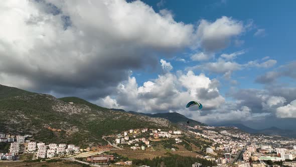 Aerial view of parachute jumper flying over beautiful Alanya