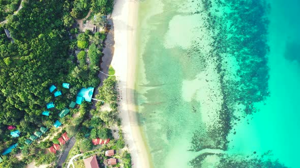 Wide angle flying island view of a summer white paradise sand beach and blue sea background in high 