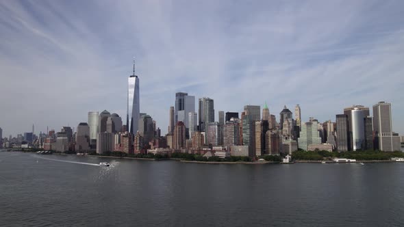 Aerial view of boats on Hudson river, in front of Battery park city, in sunny New York, USA - low, t