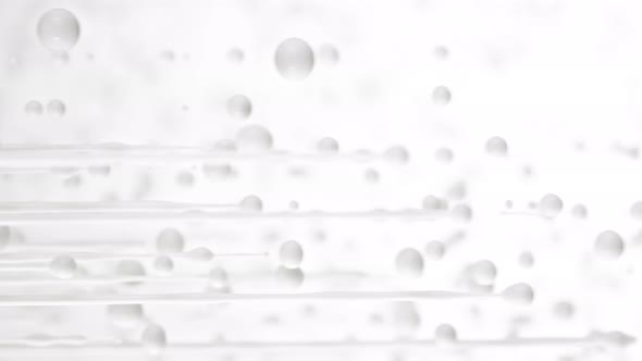 Super Slow Motion Shot of Dripping Milk on White Background at 1000 Fps