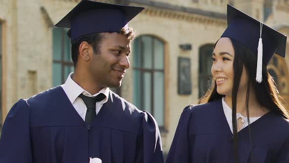 Multiracial Exchange Students Celebrating Graduation, Posing With Diplomas