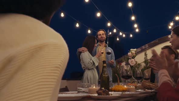 Family and friends having dinner together