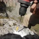 Close-up of the Hammer Drill a Hole in the Rock - VideoHive Item for Sale