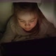 Girl Watching Film on Tablet at Night - VideoHive Item for Sale