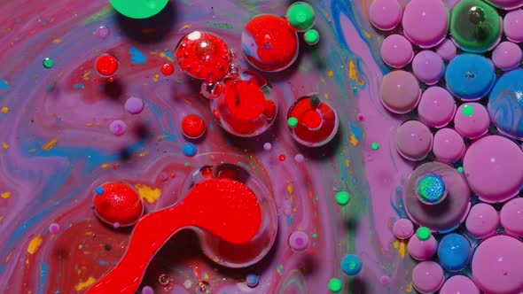 Ink Bubbles Mixed with Liquid Substance of Oil Milk Soap Bright Acrylic Paint on Colorful Surface