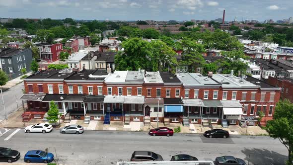 Boarded up low income housing in unsafe community in USA. Aerial truck shot of crime infested commun