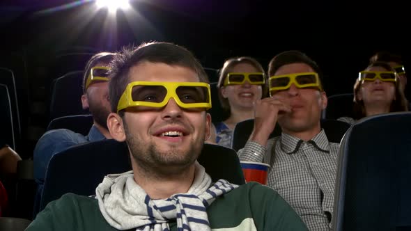 Young Mans Watching Movie at Cinema: 3D Comedy. Close Up