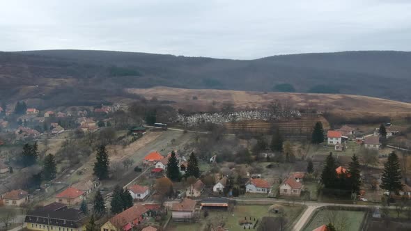 Aerial view of the cemetery of Hungarian village Alsópetény at winter