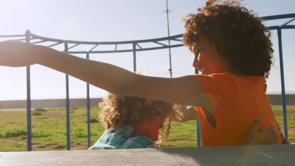 Mother and son having fun at playground