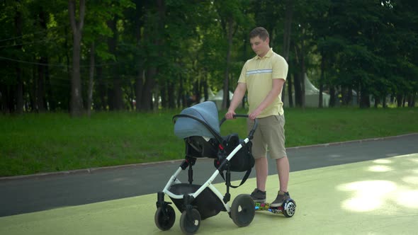 A Young Father Rides a Gyro Scooter and Carries a Stroller with a Child