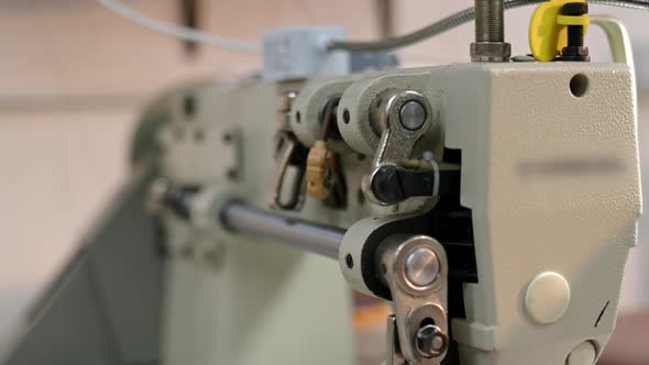 Close Up Details of Working Sewing Machine During Day in Sunlight