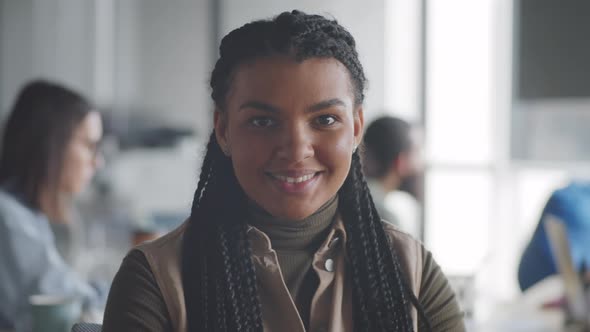 Portrait of Positive Afro-American Woman in Office