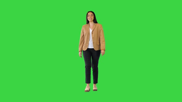 Indian Girl Walking and Smiling on a Green Screen Chroma Key