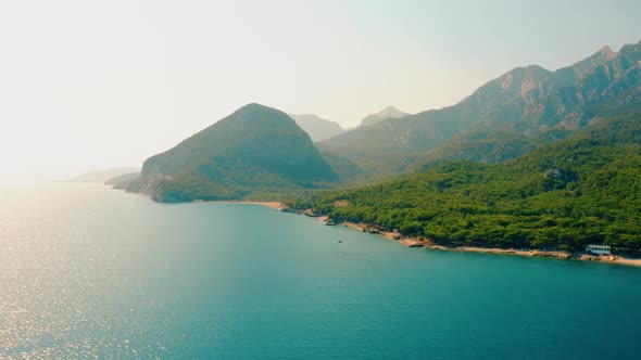 Beautiful Landscape with Turquoise Sea Water and Green Mountains