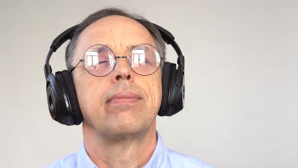 Happy Older Man Listening to Music