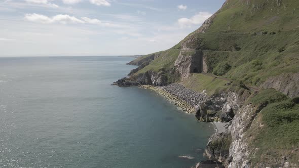 Coastal Cliff And Train Track In Wicklow. Bray To Greystones Cliff Walk In Ireland. aerial