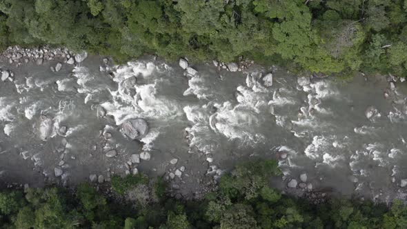 Top down, aerial view of sub tropical river in the Andes of Ecuador