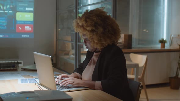 Black Businesswoman Working Late in Office