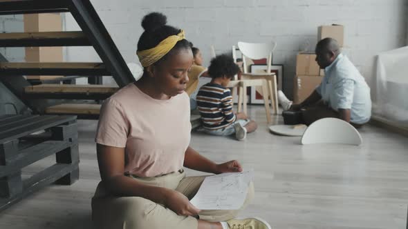 Cheerful African-American Woman Posing at Home