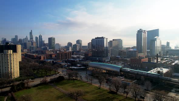 Subway Train Leaving Downtown City Skyline Aerial Drone