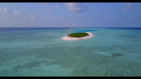 Aerial scenery of idyllic seashore beach adventure by shallow sea with white sandy background of a d