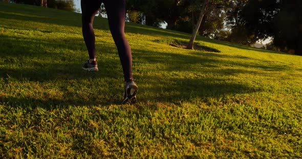 Athletic Woman Running Up A Hill Slow-Motion