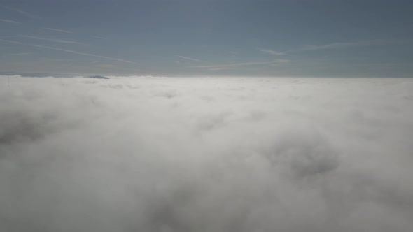 Time-lapse of A Drone flying above the clouds.