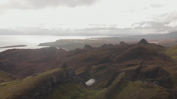 Stunning drone shot quiraing mountain and hill landscape in isle of skye scotland covered by green g