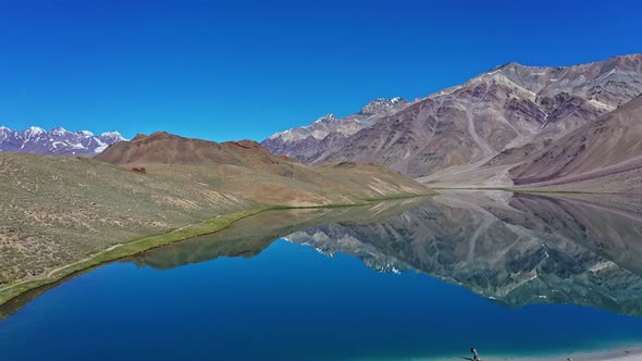 Beautiful Aerial Shot of Chandratal Lake , Spiti Valley , Moon Lake ,Tilt Up , Fast Moving