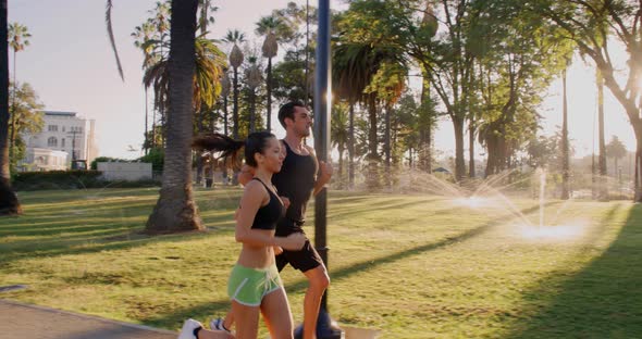 Athlete Couple Jogging In The Park