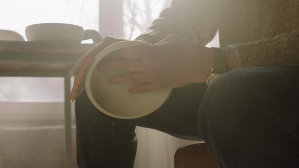 Woodman Is Polishing Wooden Bowl