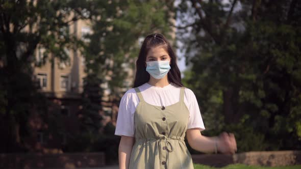 Happy Woman Remove Protective Mask on the Street End of Epidemic COVID19 Over