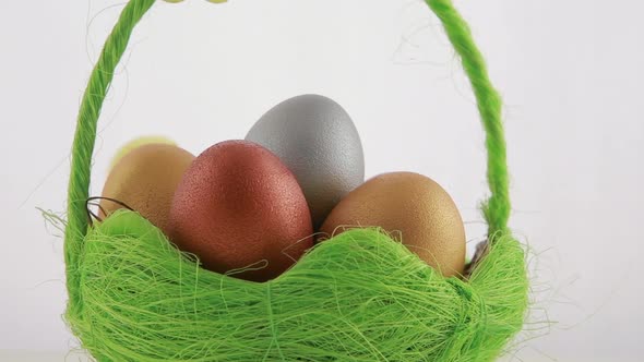 Golden Easter Eggs in Green Basket