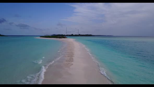 Aerial tourism of idyllic island beach vacation by blue sea with white sandy background of a dayout 