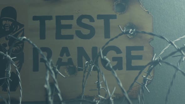 Test Range Sign With Gun Smoke