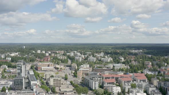 Fast downward aerial shot of an expansive city and countryside near Helsinki, Finland.