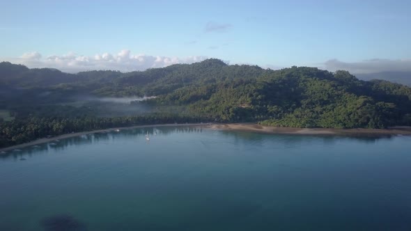 Aerial pan of small fishing village early morning in the Philippines