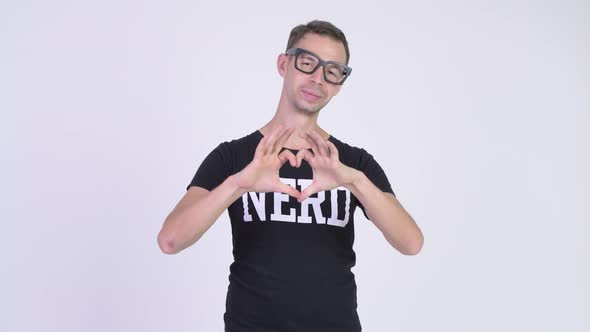 Studio Shot of Nerd Man Showing Hand Heart Gesture