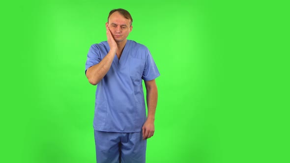 Medical Man Got a Cold, Sore Throat and Head, Cough on Green Screen at Studio. Green Screen