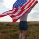 Happy Patriotic Young Woman Holds the US Flag and Runs Across the Field - VideoHive Item for Sale