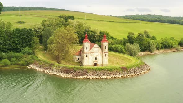 View of the historic church at the Velka Domasa dam in Slovakia