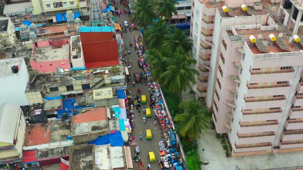 Aerial tilt up of congested urban street in Bangalore India