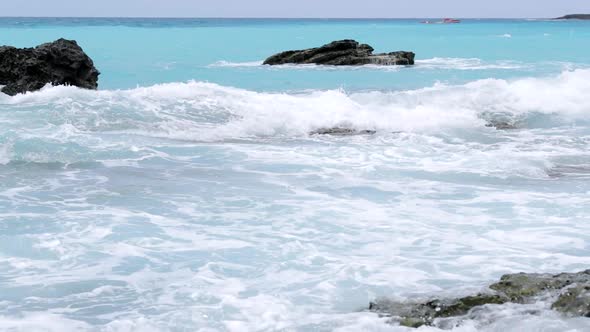 Sea waves crashing on the rock