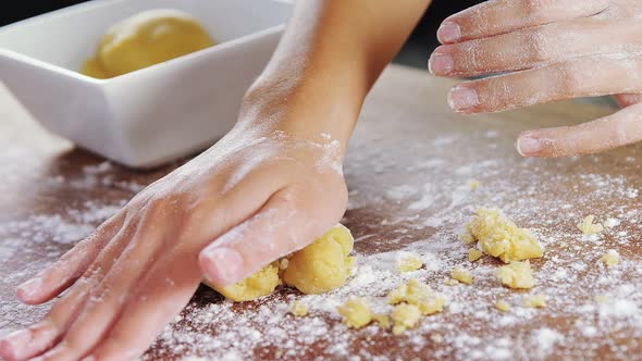 Woman preparing a dough ball