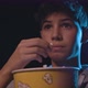 Boy watching a movie at the cinema and eating popcorn, entertainment concept - VideoHive Item for Sale