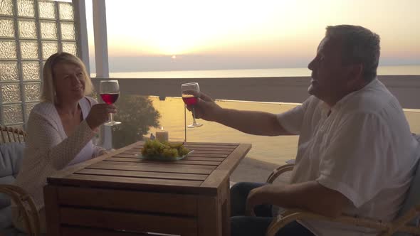 Mature Couple Spending Time on Drinking Wine