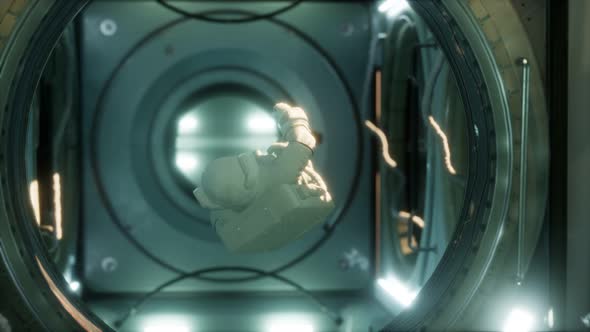 Astronaut Inside the Orbital Space Station