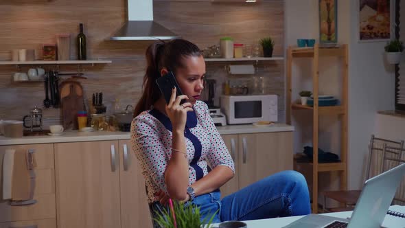 Concentrated Businesswoman During Late Phone Call