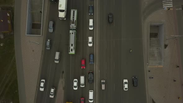 Lowangle Drone Flight Over a Massive Intersection During Early Evening Rush Hour with Cyclists